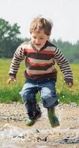 child jumping with both feet off ground