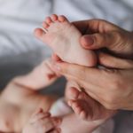 hands holding baby's foot